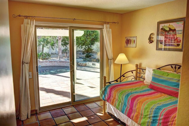 tiled bedroom with access to outside