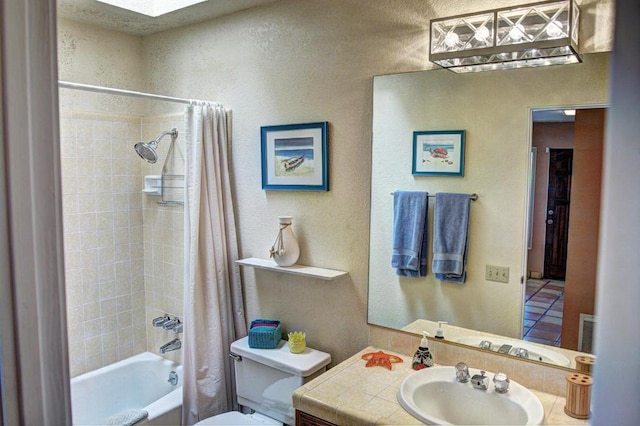 full bathroom with vanity, toilet, and shower / tub combo with curtain