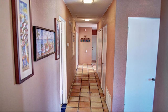 hallway with light tile patterned flooring