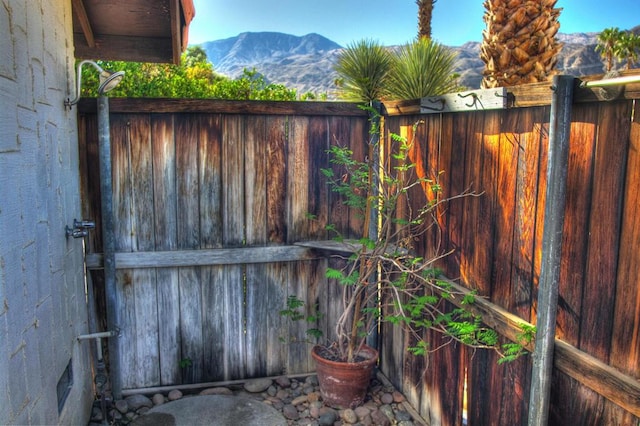 view of gate with a mountain view