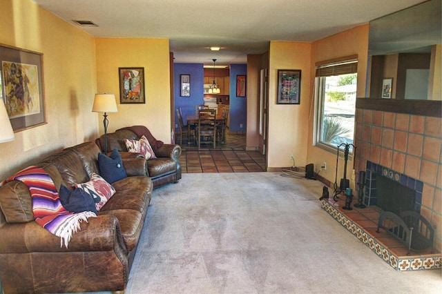 carpeted living room featuring a fireplace