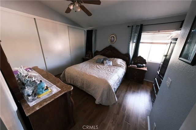 bedroom with ceiling fan, wood-type flooring, lofted ceiling, and a closet