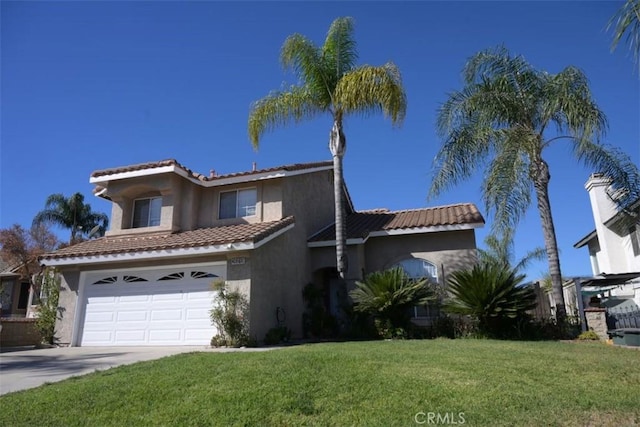 view of front of house with a front yard and a garage