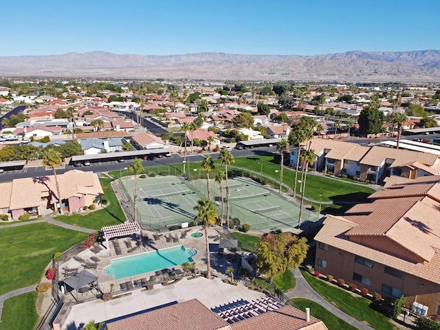 birds eye view of property with a mountain view