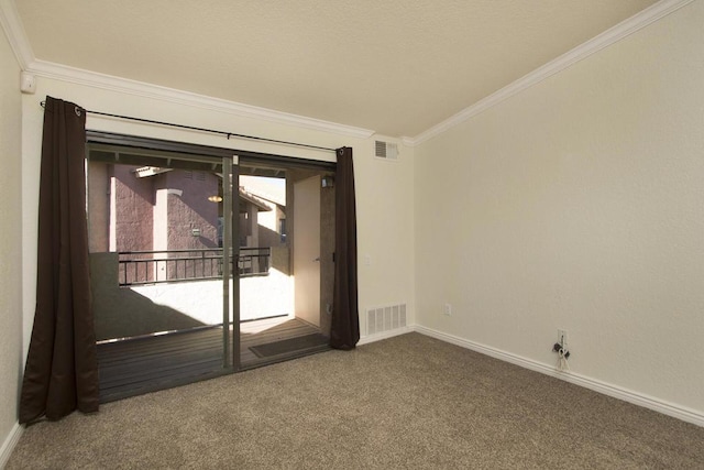 spare room featuring carpet and ornamental molding