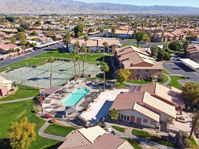 birds eye view of property featuring a mountain view