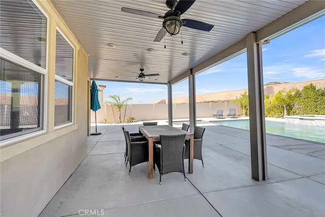 view of patio / terrace with a fenced in pool and ceiling fan