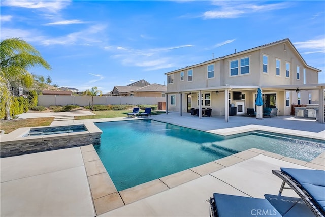 16568 Fleur Blvd, Riverside, CA 92503 - view of pool featuring an in-ground hot tub, a ceiling fan, a patio, and exterior kitchen