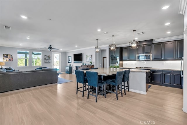 16568 Fleur Blvd, Riverside, CA 92503 - dining area with crown molding, light wood-type flooring, recessed lighting, and a ceiling fan