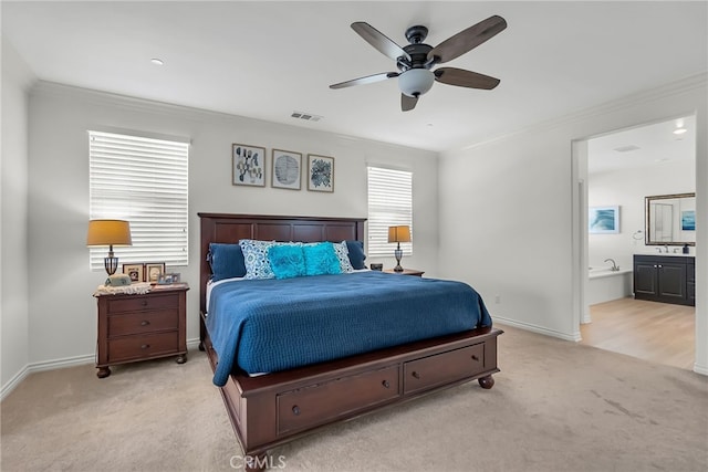 carpeted bedroom featuring connected bathroom, multiple windows, ceiling fan, and ornamental molding