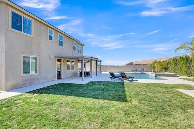 view of pool featuring a lawn, a patio area, and ceiling fan