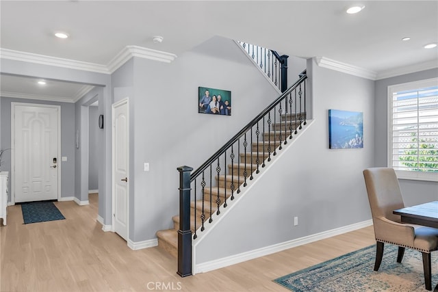16568 Fleur Blvd, Riverside, CA 92503 - foyer with wood finished floors, crown molding, stairway, and recessed lighting