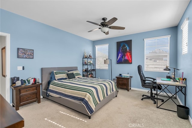 carpeted bedroom featuring ceiling fan