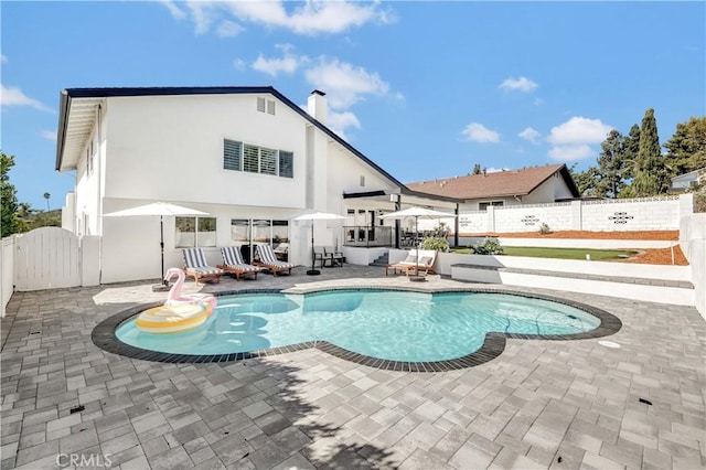 view of pool featuring a patio