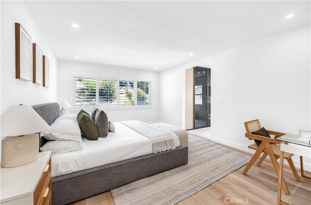 bedroom featuring light wood-type flooring