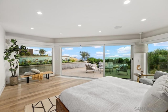 bedroom featuring access to outside and hardwood / wood-style floors