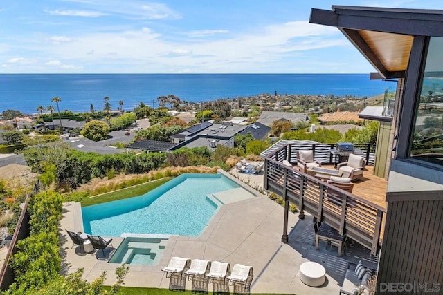 view of pool featuring a water view