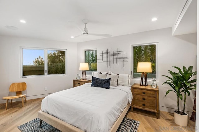 bedroom featuring ceiling fan and light hardwood / wood-style floors