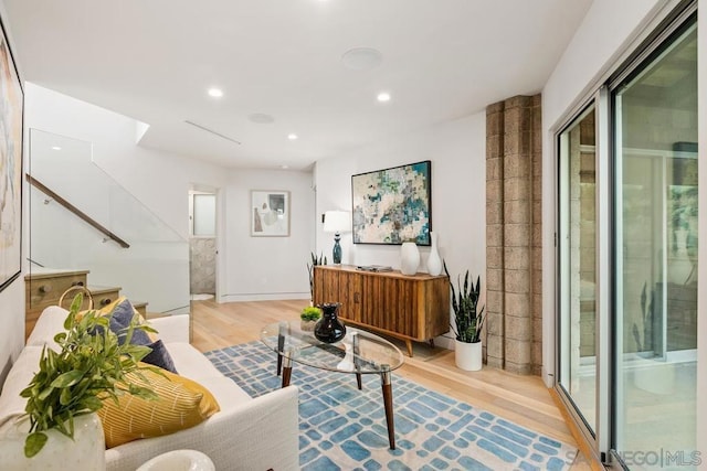 living room with light hardwood / wood-style flooring