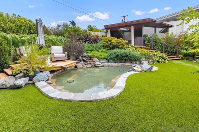 view of yard featuring a garden pond