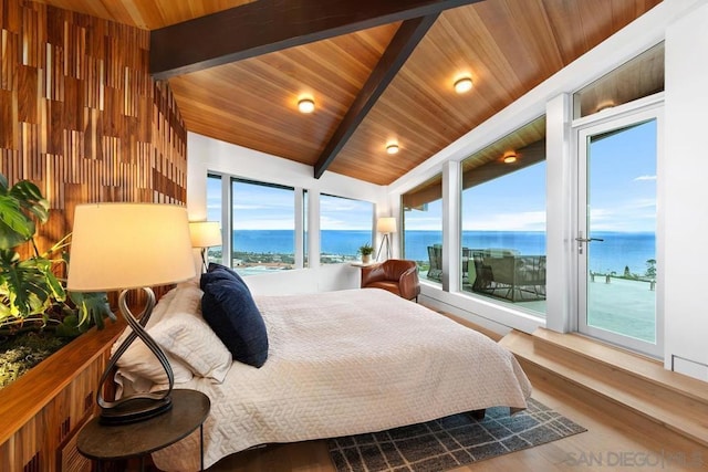 bedroom with access to outside, beam ceiling, a water view, hardwood / wood-style flooring, and wooden ceiling