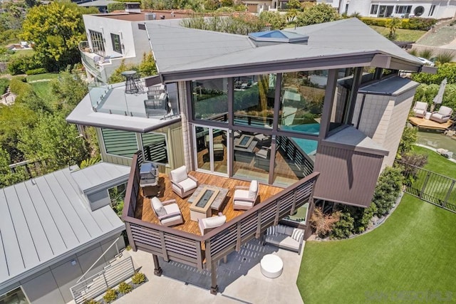 back of house featuring an outdoor hangout area