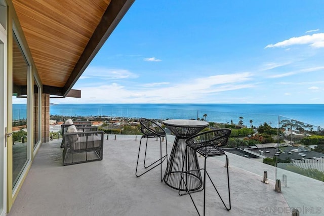 balcony featuring a water view