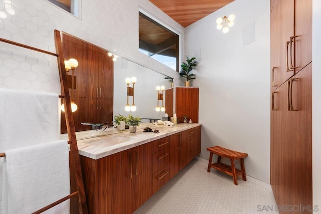 bathroom featuring vanity and an inviting chandelier