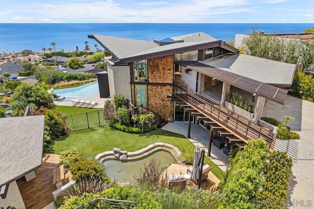 birds eye view of property featuring a water view