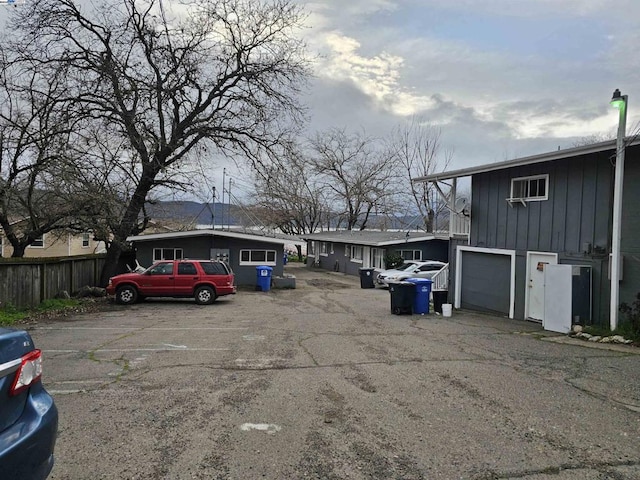 view of car parking featuring a garage