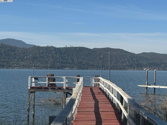 dock area with a water and mountain view