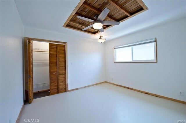 unfurnished bedroom with wooden ceiling and a closet