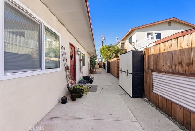 view of property exterior with a patio area