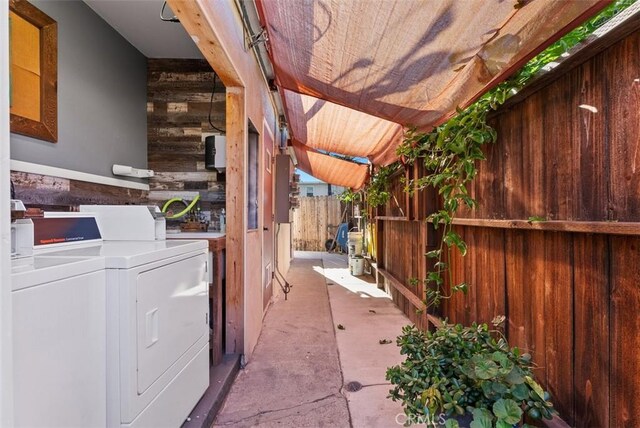 view of patio featuring independent washer and dryer