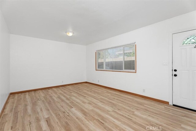 unfurnished room featuring light hardwood / wood-style flooring