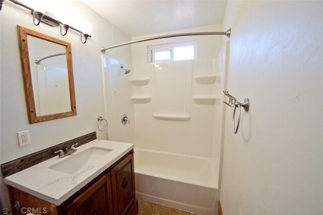 bathroom featuring shower / tub combination and vanity