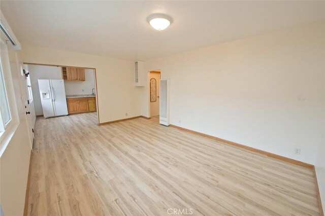 spare room featuring light hardwood / wood-style floors