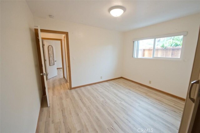 empty room with light wood-type flooring