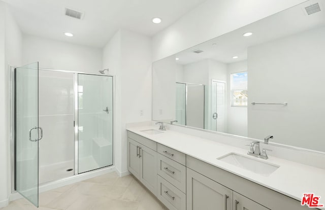 bathroom featuring vanity and walk in shower