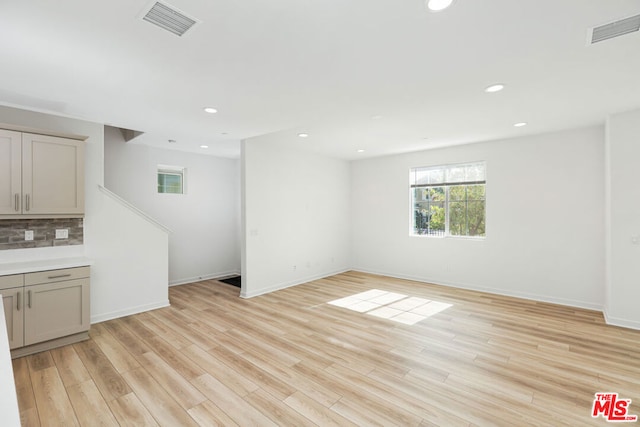 unfurnished living room featuring light wood-type flooring