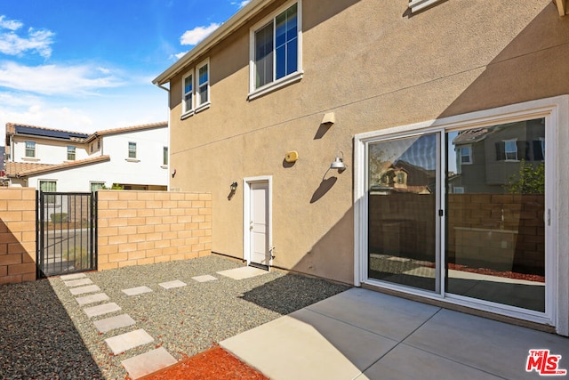 rear view of property featuring a patio area