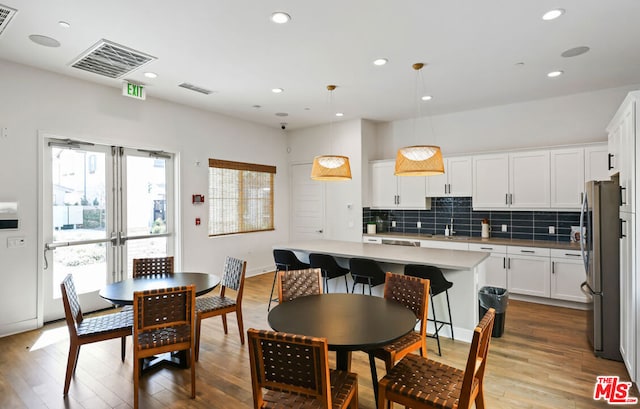 dining space featuring light wood-type flooring