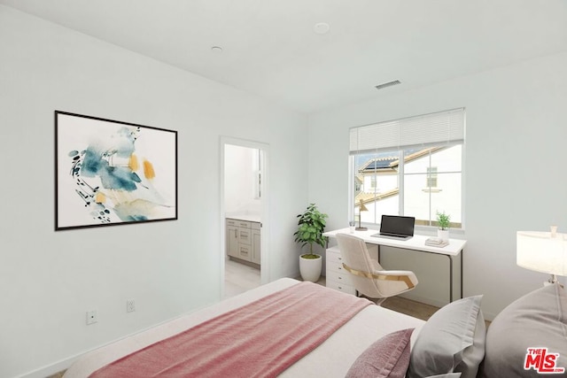 bedroom featuring ensuite bath