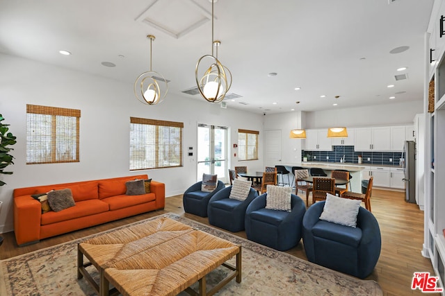 living room with light hardwood / wood-style flooring