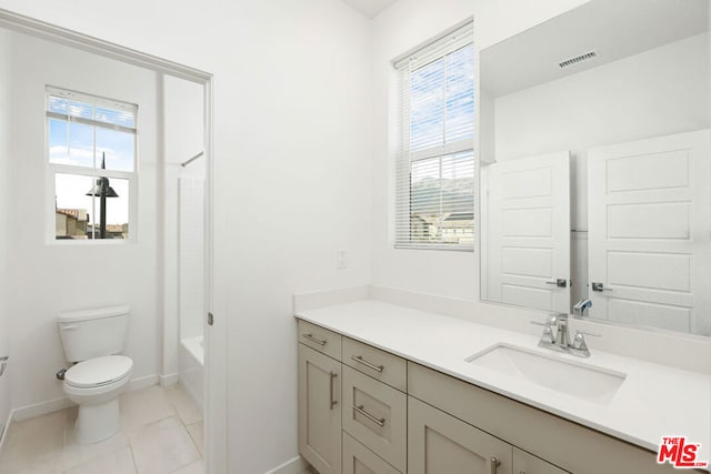 full bathroom with tile patterned floors, plenty of natural light, shower / bathtub combination, and toilet