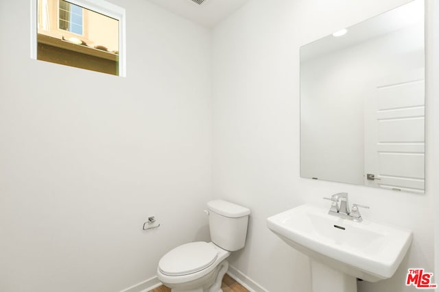 bathroom with sink and toilet