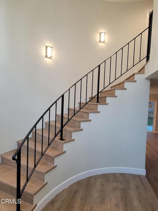 stairs with wood-type flooring