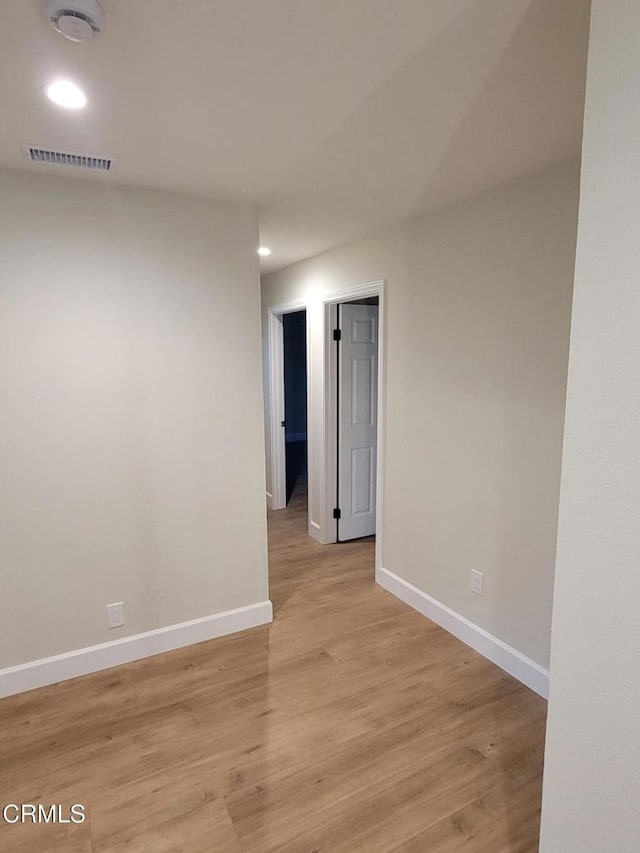 unfurnished room with light hardwood / wood-style flooring