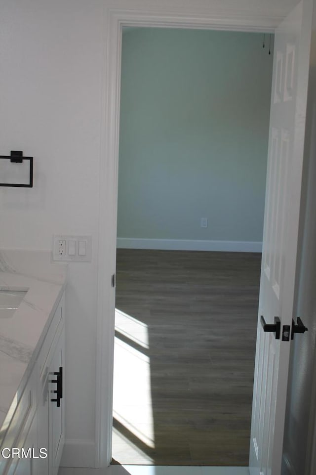 spare room with dark wood-type flooring