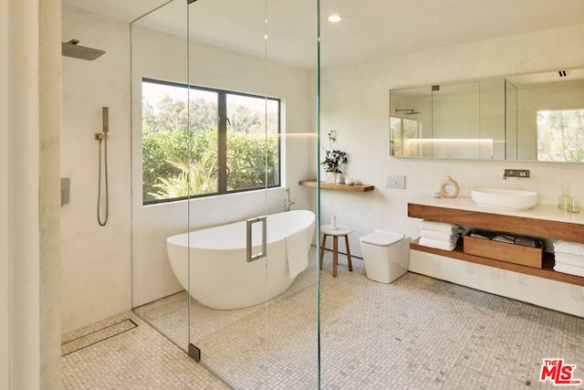 bathroom with tile patterned floors, vanity, and plus walk in shower